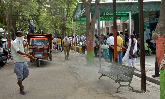 GHAZIABAD, INDIA - MAY 10: A worker spraying disinfectant to sanitize and area at Sanjay Nagar hospital on May 10, 2021 in Ghaziabad, India. (Photo by Sakib Ali Hindustan Times) Sanitation Drive To Combat Covid Pandemic