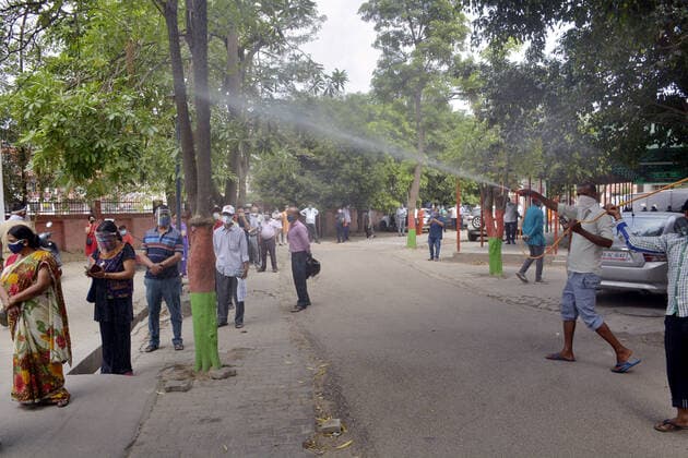 GHAZIABAD, INDIA - MAY 10: A worker spraying disinfectant to sanitize and area at Sanjay Nagar hospital on May 10, 2021 in Ghaziabad, India. (Photo by Sakib Ali Hindustan Times) Sanitation Drive To Combat Covid Pandemic