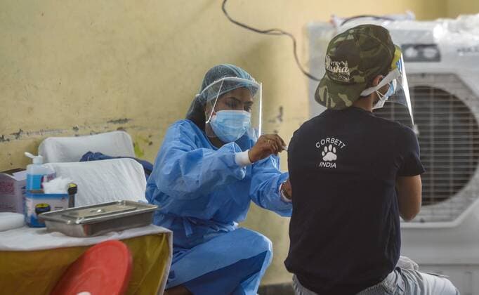 NEW DELHI, INDIA - MAY 11: A person being vaccinated against Covid-19 at Janakpuri on May 11, 2021 in New Delhi, India. (Photo by Amal KS Hindustan Times) COVID-19 Vaccination Drive