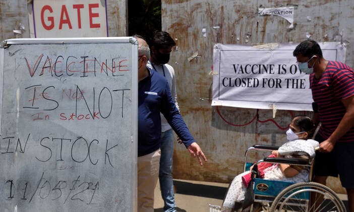 MUMBAI, INDIA - MAY 11: A banner reading Vaccine is Over, Closed for the Day hangs on the gate as the vaccines have ran out of stock at the Goregaon Vaccination Centre, on May 11, 2021 in Mumbai, India. (Photo by Satish Bate Hindustan Times ) COVID-19 Vaccination Drive