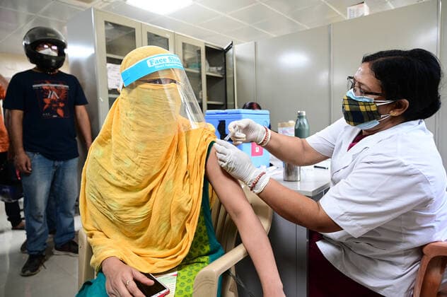 May 12, 2021, Prayagraj, Uttar Pradesh, India: Prayagraj: A Nurse inoculates COVID-19 vaccine dose on the occasion of Nurse Day Celebration at Moti Lal Nehru Medical college in Prayagraj on Tuesday. Prayagraj India - ZUMAv115 20210512_zap_v115_007 Copyright: xPrabhatxKumarxVermax