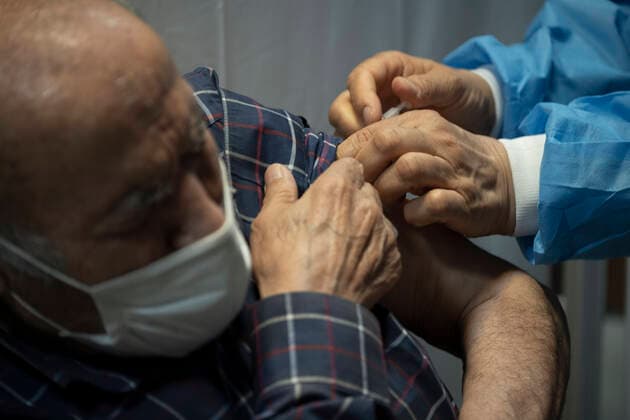 Vaccination Of People Over 80 Years By The AstraZeneca And Sinopharm COVID-19 Vaccines In Tehran An Iranian elderly man wearing a protective face mask receives a dose of the China s Sinopharm new coronavirus disease (COVID-19) vaccine, at the west Tehran health center on May 11, 2021. Tehran Tehran Iran nikoubazl-vaccinat210511_npN6N  Copyright: xMortezaxNikoubazlx