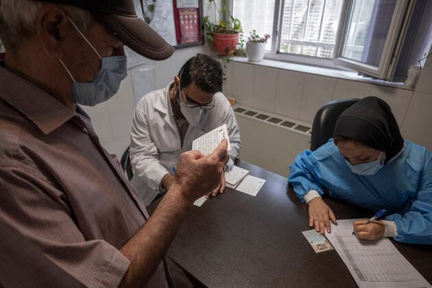 Vaccination Of People Over 80 Years By The AstraZeneca And Sinopharm COVID-19 Vaccines In Tehran An Iranian elderly man looks at a vaccine injection confirmation card after receiving a dose of the China s Sinopharm new coronavirus disease (COVID-19) vaccine, at the west Tehran health center on May 11, 2021. Tehran Tehran Iran nikoubazl-vaccinat210511_npLWz  Copyright: xMortezaxNikoubazlx