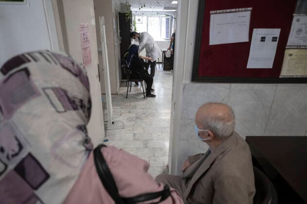 Vaccination Of People Over 80 Years By The AstraZeneca And Sinopharm COVID-19 Vaccines In Tehran An Iranian elderly woman wearing a protective face mask receives a dose of the China s Sinopharm new coronavirus disease (COVID-19) vaccine, at the west Tehran health center on May 11, 2021. Tehran Tehran Iran nikoubazl-vaccinat210511_npTrs  Copyright: xMortezaxNikoubazlx