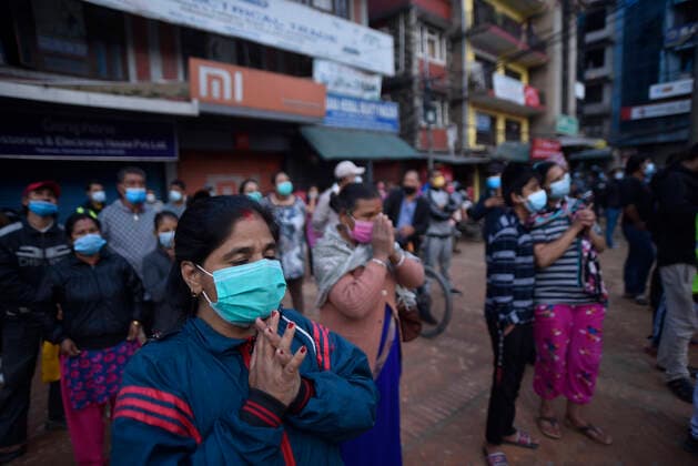 Longest Festival Rato Machindranath Begins During Prohibitory Lockdown In Kathmandu Valley Nepalese devotees along with face mask offer rituals after priests carry Rato Machindranath towards the chariot on the first day of the longest chariot festival of Nepal during prohibitory lockdown of covid pandemic in Lalitpur, Nepal on Wednesday, May 12, 2021. Rato Machindranath is also said as the God of Rain and both Hindus and Buddhists worship the Machindranath in hope of good rain to prevent drought during the rice plantation season. Lalitpur NP Nepal maharjan-longestf210512_nps8t  Copyright: xNarayanxMaharjanx
