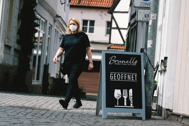 Outdoor Dinning Opens In Soest As Lock Down Measure Ease opening cafe sign is seen as a waitress walks by in Soest, Germany on May 12, 2021 as Soest and Lippstadt are two the first model cities to be selected in North Rhine Westphalian begin to relax lock down measture in the region with low infection rates Soest Germany tang-notitle210512_nppm2  Copyright: xYingxTangx