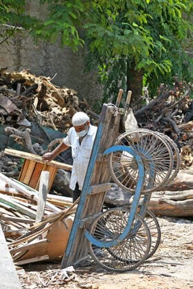 Cremation Of COVID-19 Victims In Rajasthan, India A worker pulls a handcart loaded with firewood for cremation of COVID-19 victim at Hindu Moksha Dham Crematorium in Beawar. Beawar Rajasthan India Copyright: SumitxSaraswat