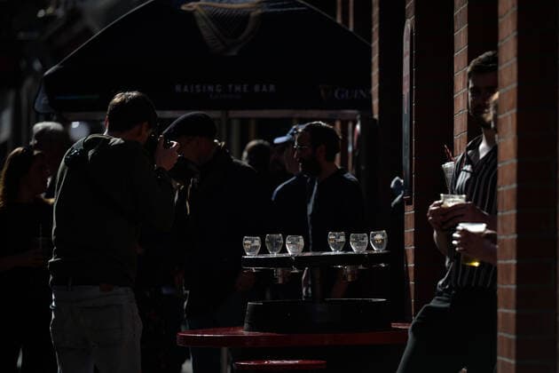 Daily Life In Dublin People enjoying a takeaway drink outside a pub in Dublin city center. On Thursday, 13 May 2021, in Dublin, Ireland. Dublin Ireland widak-dailydub210513_npqrE  Copyright: xArturxWidakx