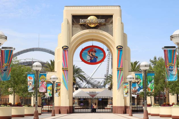 May 15, 2021, Osaka, Japan - A woman checks a notice of the temporary close at the entrance of the Universal Studios Japan amid outbreak of the new coronavirus in Osaka on Saturday, May 15, 2021. Japanese government announced to expand a COVID-19 state of emergency on May 14.  (160323372)