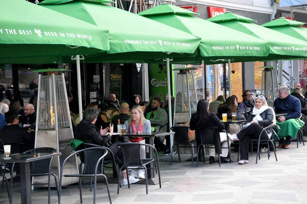 Copenhagen, Denmark. 15 May 2021,Oudoor food and drink seervice in danish cafes and bars and restaurant on hojbro plads and stroget on amager torv in danish capital. (Photo..Francis Joseph Dean Deanpictures)