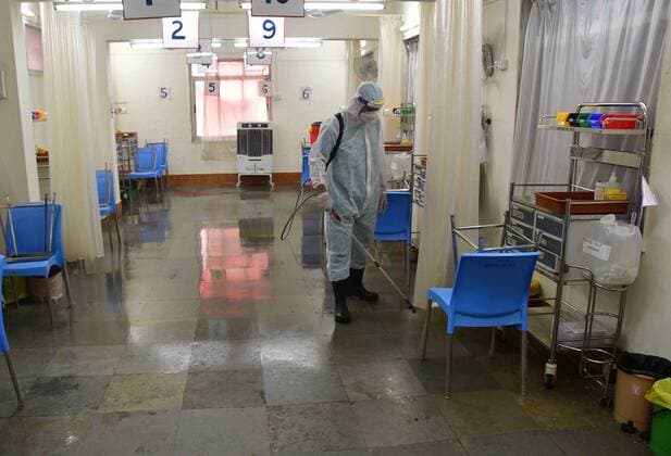 MUMBAI, INDIA ? MAY 15: BMC worker sanitizes the Vaccination Centre at Nair Hospital, as the centres are closed for two days on May 15, 2021 in Mumbai, India. (Photo by Bhushan Koyande Hindustan Times ) COVID-19 Vaccination Drive