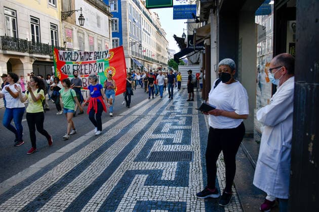 May 15, 2021, Lisbon, Portugal: Protesters hold a banner while marching on the street during the demonstration..Thousands of people demonstrated in Lisbon on Saturday against the Portuguese government s handling of the covid-19 pandemic and for greater individual and social freedom from social restrictions under the emergency decree. Lisbon Portugal - ZUMAs197 20210515_zaa_s197_218 Copyright: xJorgexCastellanosx