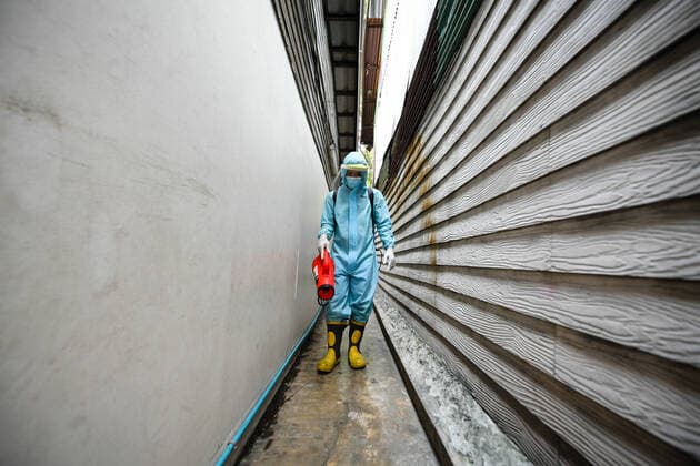 May 16, 2021, Bangkok, Thailand: A rescue worker wearing a Personal Protective Equipment (PPE) sprays a disinfectant at Klong Toey slum community in Bangkok..The Public Health Ministry on Sunday reported 24 more Covid-19-related deaths, for a toll of 589 and 2,302 new cases, raising the total to 72,584. Bangkok Thailand - ZUMAs197 20210516_zaa_s197_127 Copyright: xAmpholxThongmueangluangx