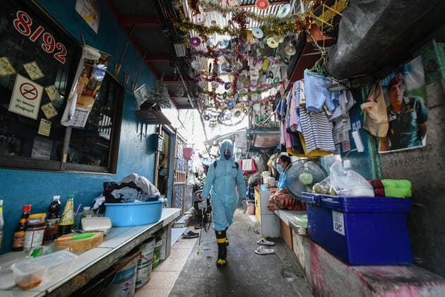 May 16, 2021, Bangkok, Thailand: A rescue worker wearing a Personal Protective Equipment (PPE) sprays a disinfectant at Klong Toey slum community in Bangkok..The Public Health Ministry on Sunday reported 24 more Covid-19-related deaths, for a toll of 589 and 2,302 new cases, raising the total to 72,584. Bangkok Thailand - ZUMAs197 20210516_zaa_s197_129 Copyright: xAmpholxThongmueangluangx