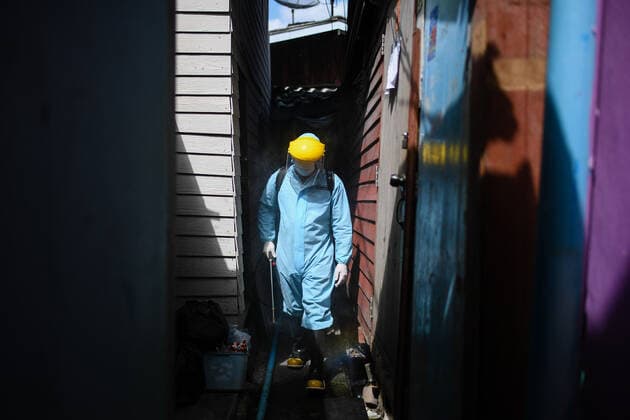 May 16, 2021, Bangkok, Thailand: A rescue worker wearing a Personal Protective Equipment (PPE) sprays a disinfectant at Klong Toey slum community in Bangkok..The Public Health Ministry on Sunday reported 24 more Covid-19-related deaths, for a toll of 589 and 2,302 new cases, raising the total to 72,584. Bangkok Thailand - ZUMAs197 20210516_zaa_s197_130 Copyright: xAmpholxThongmueangluangx