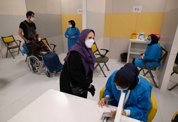 Day-3 Of Mass General COVID-19 Vaccination In The Iran Grand Bazaar, Iran Mall, In Western Tehran An Iranian elderly woman (C) wearing a protective face mask waits to receive a dose of the China s Sinopharm new coronavirus disease (COVID-19) vaccine on day-3 of the mass general COVID-19 vaccination in the Iran Grand Bazaar (Market), Iran Mall, in western Tehran on May 17, 2021. Tehran Tehran Iran nikoubazl-day3ofma210517_npu2v  Copyright: xMortezaxNikoubazlx