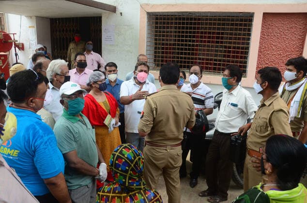 May 17, 2021, Prayagraj, Uttar Pradesh, India: Prayagraj: Policeman talk with beneficiaries as they demonstrate against lack of vaccine during second wave of CORONAVIRUS in Prayagraj on Monday, May 17, 2021. Prayagraj India - ZUMAv115 20210517_zap_v115_003 Copyright: xPrabhatxKumarxVermax