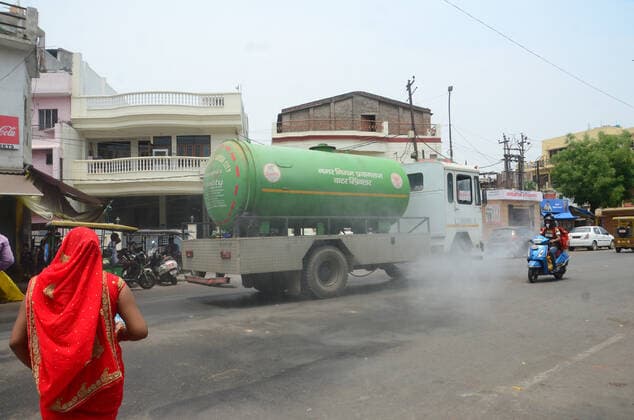 May 17, 2021, Prayagraj, Uttar Pradesh, India: Prayagraj: A Municipal corporation vehicle sanitise road during second wave of CORONAVIRUS in Prayagraj on Monday, May 17, 2021. Prayagraj India - ZUMAv115 20210517_zap_v115_004 Copyright: xPrabhatxKumarxVermax