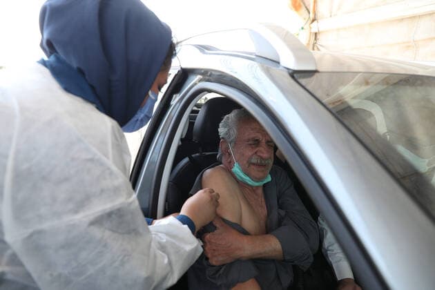 May 16, 2021, Munich, Bavaria, Germany: TEHRAN, IRAN - MAY, 16: A person receives a dose of Covid-19 vaccine at a drive-thru vaccination in iran on May 16, 2021 in Tehran, Iran. Munich Germany - ZUMAa283 20210516_zna_a283_004 Copyright: xMohammadrezaxAbbasix