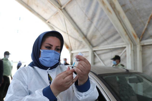 May 16, 2021, Munich, Bavaria, Germany: TEHRAN, IRAN - MAY, 16: A person receives a dose of Covid-19 vaccine at a drive-thru vaccination in iran on May 16, 2021 in Tehran, Iran. Munich Germany - ZUMAa283 20210516_zna_a283_012 Copyright: xMohammadrezaxAbbasix