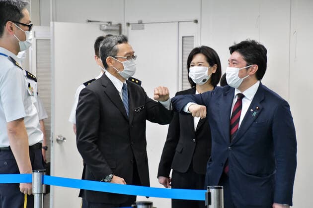 Japan s State Minister of Defense, Yasuhide Nakayama bumps fists with Tokyo operation units commander and Director of Self-defence forces central hospital, Koji Fukushima(L2) during a launch for large-scale Covid-19 vaccination centres in Tokyo, Japan on Monday, May 17, 2021. This centre will open on May 24, 2021. Tokyo operation units organize Ground, Air and Maritime Self?Defense Forces (Army, Air force and Navy) 240 officer and private 110 medical worker out of 350 members.  TKP2021051743 KEIZOxMORI