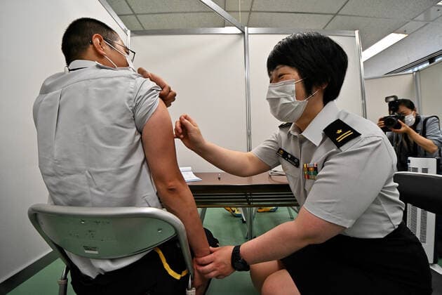 Japan Self?Defense Forces officer demonstrate during a launch for large-scale Covid-19 vaccination centres in Tokyo, Japan on Monday, May 17, 2021. This centre will open on May 24, 2021. Tokyo operation units organize Ground, Air and Maritime Self?Defense Forces (Army, Air force and Navy) 240 officer and private 110 medical worker out of 350 members.  TKP2021051749 KEIZOxMORI