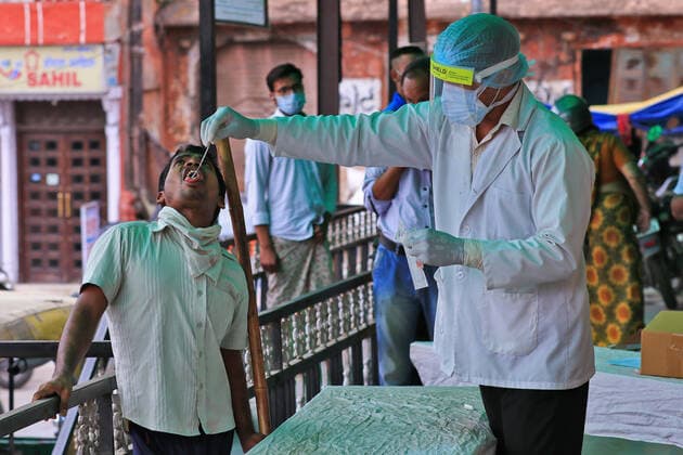 COVID-19 Testing In Jaipur A health worker collects swab sample of a man during the COVID-19 testing, amid in surge of coronavirus cases in Jaipur, Rajasthan, India, Monday, May 17,2021. Jaipur Rajasthan India bhatnagar-notitle210517_nppbt  Copyright: xVishalxBhatnagarx