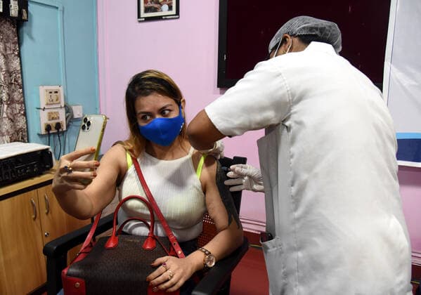 May 17, 2021, Guwahati, Assam, India: A woman takes selfie as she received first dose of COVID-19 ijection during vaccination programme for 18 to 44 years old in Guwahati Assam India on Monday 17th May 2021 Guwahati India - ZUMAd163 20210517_zip_d163_025 Copyright: xDasarathxDekax