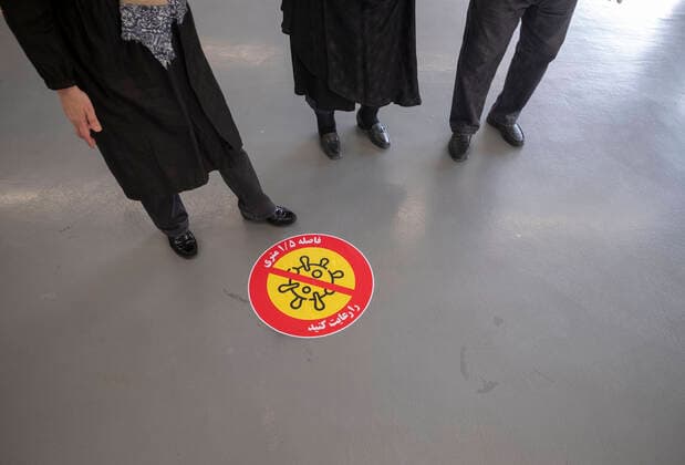 Virus Outbreak Iran Iranian elderly people stand next to a social distancing sign as they wait to enter the main vaccination hall to receive a dose of the China s Sinopharm new coronavirus disease (COVID-19) vaccine on day-3 of the mass general COVID-19 vaccination in the Iran Grand Bazaar (Market), Iran Mall, in western Tehran on May 17, 2021. Tehran Tehran Iran nikoubazl-day3ofma210517_npWKQ  Copyright: xMortezaxNikoubazlx