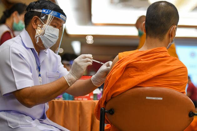 Thailand: Vaccination against COVID-19 for Buddhist monks in Bangkok A Thai Buddhist monk reacts as he receives a shot of Sinovac vaccine, developed by China s firm during a vaccination drive against the COVID-19 coronavirus pandemic at the Priest Hospital in Bangkok. Bangkok Thailand Copyright: VichanxPoti