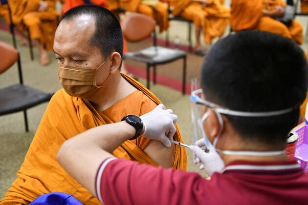 Thailand: Vaccination against COVID-19 for Buddhist monks in Bangkok A Thai Buddhist monk reacts as he receives a shot of Sinovac vaccine, developed by China s firm during a vaccination drive against the COVID-19 coronavirus pandemic at the Priest Hospital in Bangkok. Bangkok Thailand Copyright: VichanxPoti