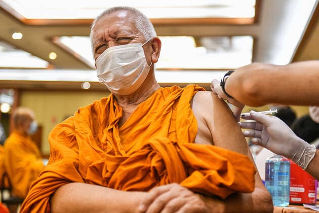 Thailand: Vaccination against COVID-19 for Buddhist monks in Bangkok A Thai Buddhist monk reacts as he receives a shot of Sinovac vaccine, developed by China s firm during a vaccination drive against the COVID-19 coronavirus pandemic at the Priest Hospital in Bangkok. Bangkok Thailand Copyright: VichanxPoti
