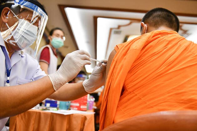 Thailand: Vaccination against COVID-19 for Buddhist monks in Bangkok A Thai Buddhist monk reacts as he receives a shot of Sinovac vaccine, developed by China s firm during a vaccination drive against the COVID-19 coronavirus pandemic at the Priest Hospital in Bangkok. Bangkok Thailand Copyright: VichanxPoti