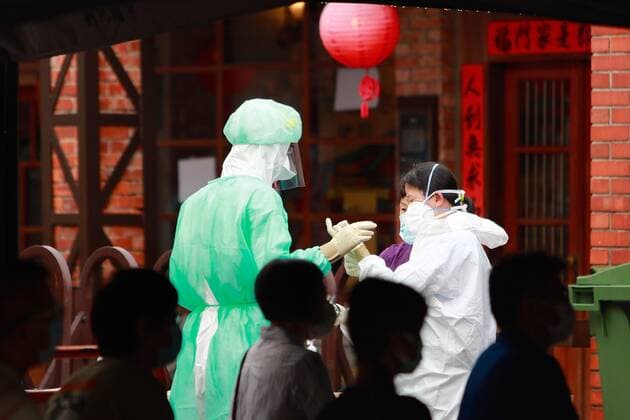 May 19, 2021, Taipei, Taipei, Taiwan: Military officers wearing personal protective equipment seen at a rapid Covid testing center in Wanhua District, one of the infected areas in Taipei, as the government has raised the Covid alert to level 3 across the country, following a surge of domestic cases across the island. Taiwan on Wednesday registered 267 domestic cases, in which some were transmitted at five hospitals. Non essential businesses, schools and many other sectors have been closed for curbing the spread of the coronavirus in communities. Taipei Taiwan - ZUMAs313 20210519_zip_s313_004 Copyright: xDanielxCengxShou-Yix