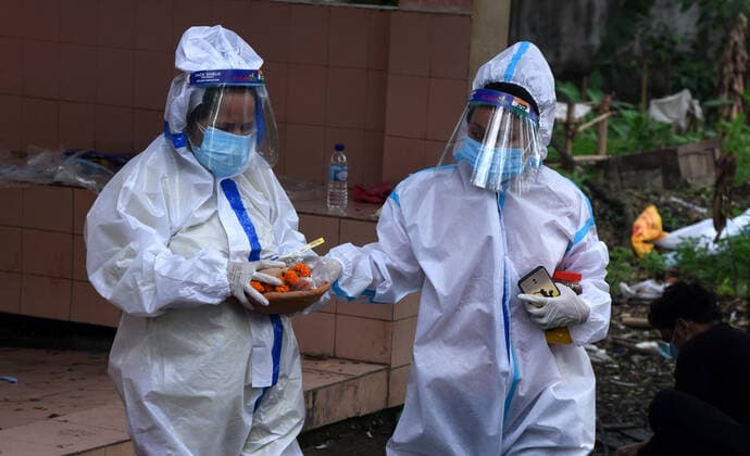 May 19, 2021, Guwahati, Guwahati, India: Relatives on their way to perform the last rites of person who died in COVID-19 as coronavirus surge in the state in Guwahati Assam India on Wednesday 19th May 2021. Guwahati India - ZUMAd163 20210519_zip_d163_012 Copyright: xDasarathxDekax