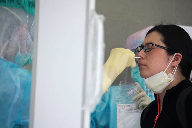 May 19, 2021, New Taipei, Taiwan: A heath worker takes a nasal swab sample from a woman during the COVID-19 pandemic..The Taiwanese government is offering free COVID-19 swab testing for its citizens. New Taipei Taiwan - ZUMAs197 20210519_zaa_s197_045 Copyright: xAnnabellexChihx