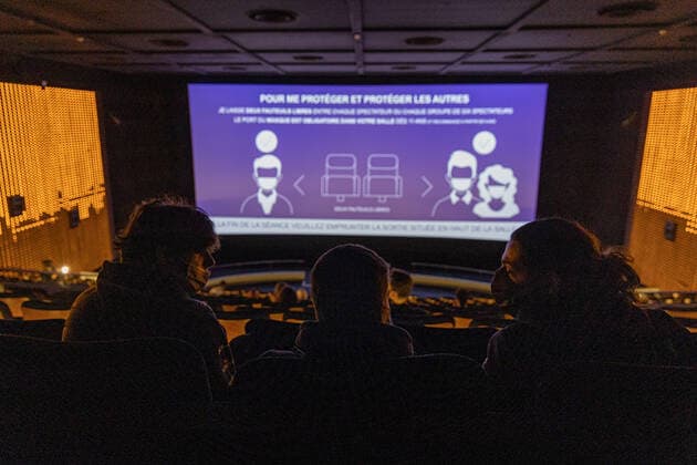 (210519) -- PARIS, May 19, 2021 -- People are seen at a reopened cinema in Paris, France, on May 19, 2021. France on Wednesday took an important step forward toward returning to normality as people in the country can once again meet up in cafes or enjoy a meal in restaurants, which are now allowed to open their terraces. Under the government s current plan to gradually relax the confinement measures, a maximum of six people per table are now allowed to be served on restaurant and cafe terraces. Museums, theaters, cinemas and sports facilities can now reopen to a maximum of 800 people indoors and 1,000 outdoors. (Photo by Xinhua) FRANCE-PARIS-COVID-19-REOPENING AurelienxMorissard 