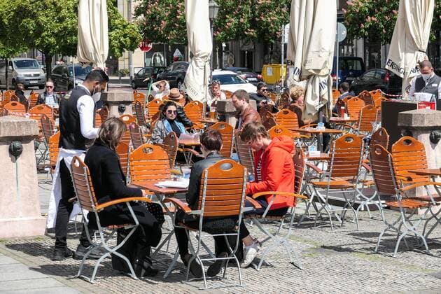 (210522) -- BERLIN, May 22, 2021 -- Guests are seen at the outdoor area of a restaurant in Berlin, capital of Germany, May 21, 2021. Restaurants in Berlin are allowed to serve guests outdoors from Friday. (Photo by Xinhua) GERMANY-BERLIN-COVID-19-RESTAURANTS StefanxZeitz 