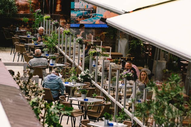 Outdoor Dinning Opens In Duesseldorf people enjoys lunch inside an outdoor restaurant in Duesseldorf, Germany on May 21, 2021 as Duesseldorf reopens the outdoor dinning to easing of coronavirus lockdown measures Duesseldorf Germany tang-notitle210521_npdN8  Copyright: xYingxTangx