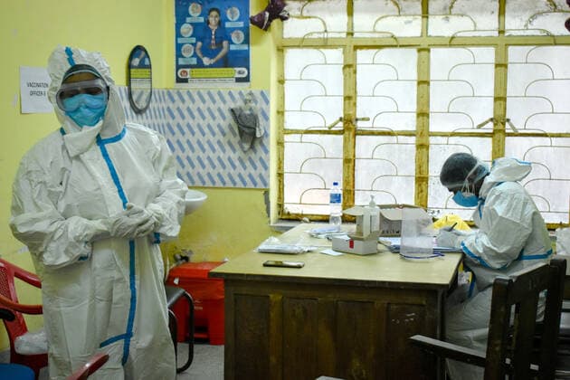 India: Covid-19 testing in Kolkata Healthcare workers are wearing PPE (Personal protective equipment) and eye goggles and working inside a Government health centre in Kolkata. Kolkata West Bengal India Copyright: SudiptaxDas