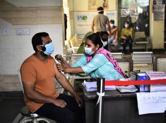 GURUGRAM, INDIA - MAY 21: A medic administers a dose of Covid-19 vaccine to a beneficiary, at Sector 31 Poly Clinic, on May 21, 2021 in Gurugram , India. (Photo by Vipin Kumar Hindustan Times) COVID-19 Vaccination Drive