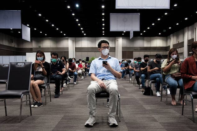 May 25, 2021, Bangkok, Thailand: People wait for their turn to get vaccinated with Sinovac vaccine during vaccination against COVID-19 coronavirus disease for aircrew members and employees of commercial airlines at Siam Paragon shopping mall in Bangkok. Bangkok Thailand - ZUMAs197 20210525_zaa_s197_080 Copyright: xPeeraponxBoonyakiatx