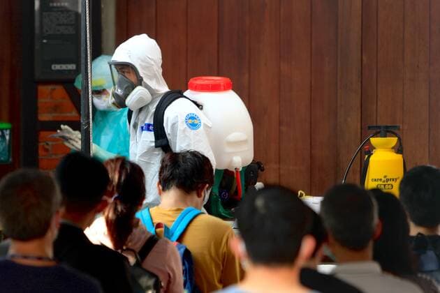 May 26, 2021, Taipei, Taipei, Taiwan: Military officers in protective suits disinfects a rapid Covid-19 testing centre in Taipei, following a spike in the number of domestic Covid-19 cases. Taiwan Center for Disease Control on Wednesday reported 304 new domestic cases, 331 adjusted cases, and 11 deaths while facing inadequate vaccines supply in the face of the ongoing community transmission. Taipei Taiwan - ZUMAs313 20210526_zip_s313_016 Copyright: xDanielxCengxShou-Yix
