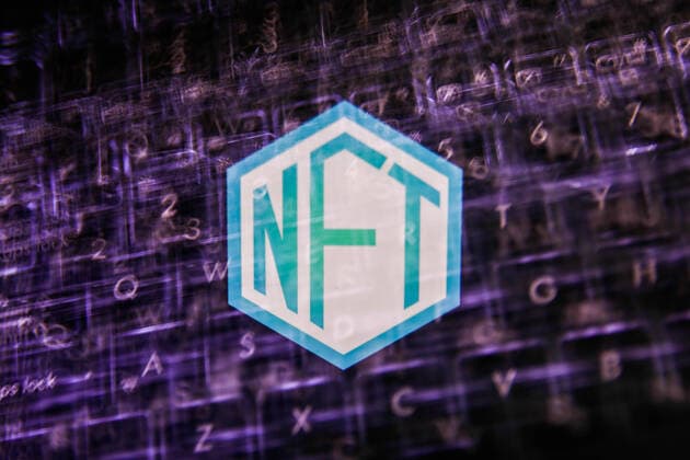 NFT Photo Illustrations Non-fungible token - NFT logo displayed on a screen and a laptop keyboard are seen in this double exposure illustration photo taken in Krakow, Poland on May 26, 2021. Krakow Poland porzycki-nftphoto210526_nprVQ  Copyright: xJakubxPorzyckix