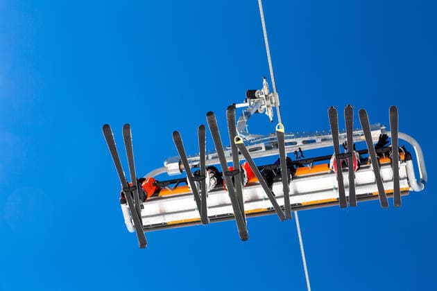 Skiers in a ski lift passing in the air Copyright: xx 20535940