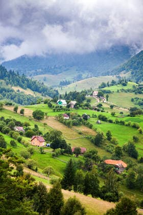 Rural landscape of Magura village, 1000 metres up in the mountains, in the Piatra Craiului National Park, Romania, Europe Copyright: NagyxMelinda 1265-154