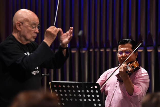 American conductor Dennis Russell Davies, left, and Mexican violist Jose Adolfo Alejo Solis, right, perform with Brno Philharmonic during a dress rehearsal for the opening concert of the Leos Janacek International Music Festival in Ostrava, Czech Republic, May 27, 2021. (CTKxPhoto JaroslavxOzana) CTKPhotoP2021052708416  JAO 03