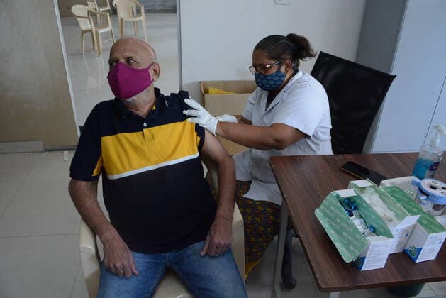 MUMBAI, INDIA - MAY 28: Senior citizens and beneficiaries in the above 45 age group get vaccinated against Covid-19 at TMC s vaccination centre at Majiwada, in Thane, on May 28, 2021 in Mumbai, India. (Photo by Praful Gangurde Hindustan Times ) COVID-19 Vaccination Drive
