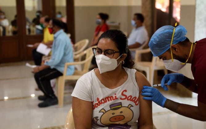 MUMBAI, INDIA - MAY 28: Beneficiaries get vaccinated against Covid-19 at Raheja Complex, after government permitted residential complexes to start vaccination centres from today, on May 28, 2021 in Mumbai, India. (Photo by Satish Bate Hindustan Times ) COVID-19 Vaccination Drive