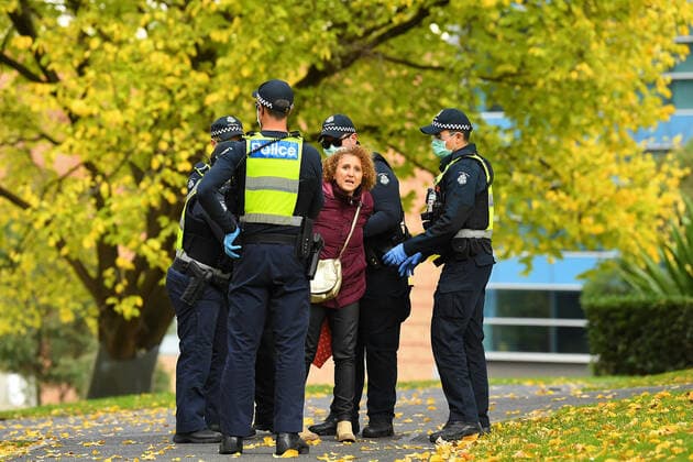 VICTORIA CORONAVIRUS COVID19, Victoria Police detain a protester at Flagstaff Gardens in Melbourne, Saturday, May 29, 2021. Anti-lockdown and anti vaccination protesters are demonstrating in defiance of Victorian health directives and mandatory stay-at-home orders following a 7 day lockdown. ( NO ARCHIVING, EDITORIAL USE ONLY, NO USE IN BOOKS WITHOUT CONSENT MELBOURNE VIC AUSTRALIA  Copyright: xJAMESxROSSx 20210529001545920431